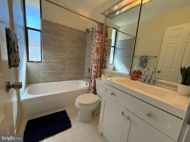 bathroom featuring tile patterned flooring, shower / bathtub combination with curtain, vanity, and toilet