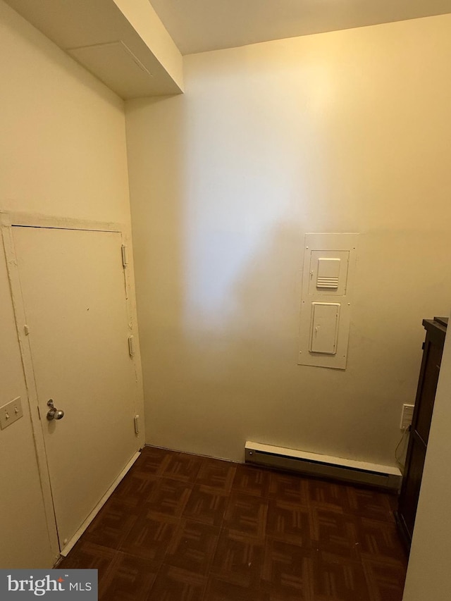 interior space featuring electric panel and baseboard heating