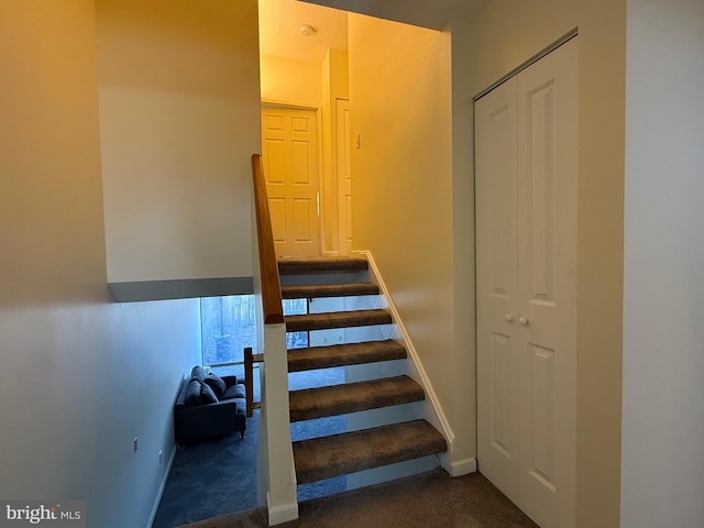 stairway featuring baseboards