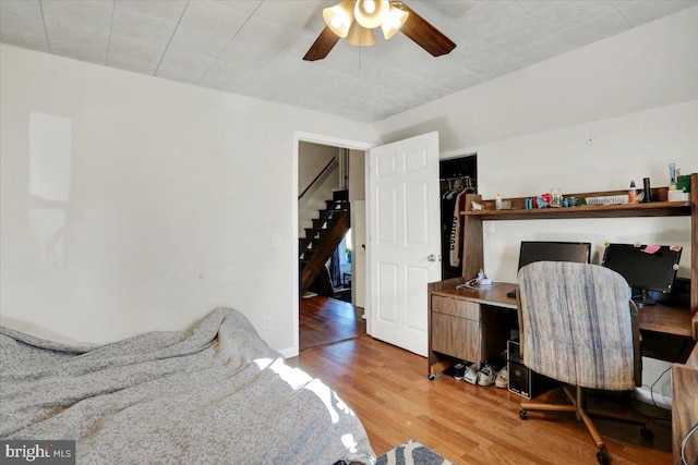 bedroom featuring ceiling fan and wood finished floors