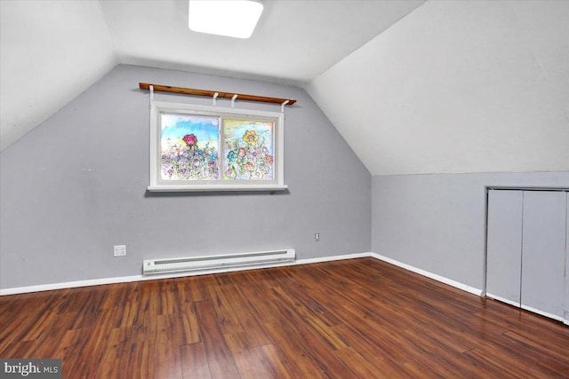 bonus room featuring a baseboard heating unit, vaulted ceiling, wood finished floors, and baseboards