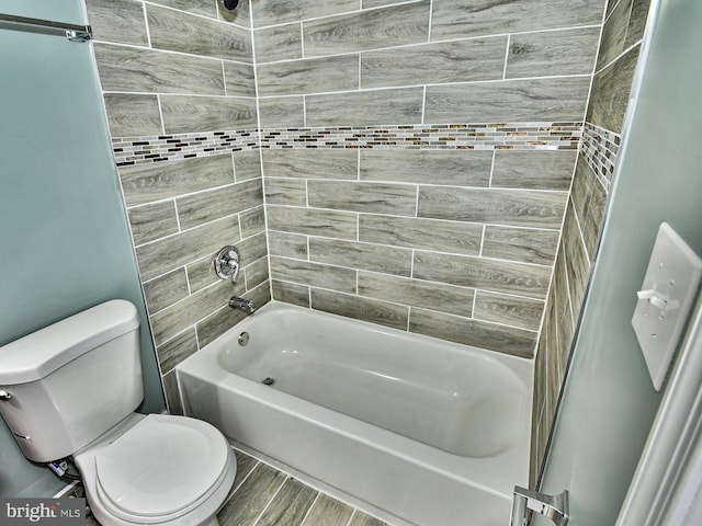 full bath with toilet, shower / bathtub combination, and wood finish floors