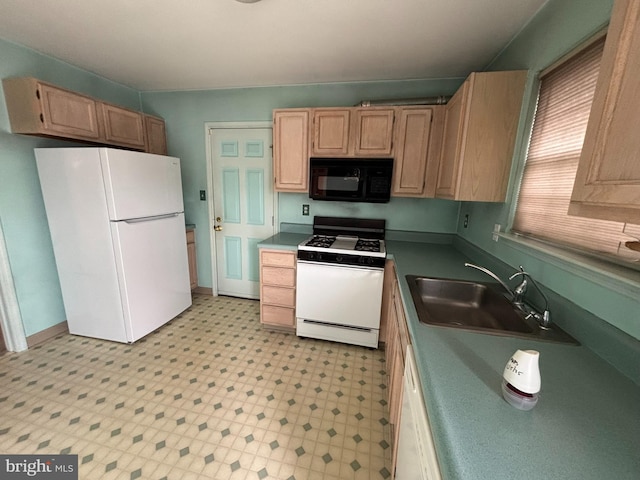 kitchen featuring white appliances, light floors, a sink, and light brown cabinetry