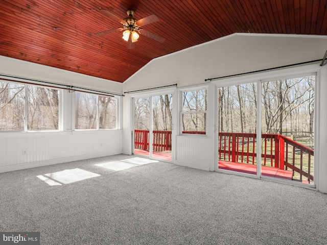 unfurnished sunroom featuring lofted ceiling, wood ceiling, and a ceiling fan