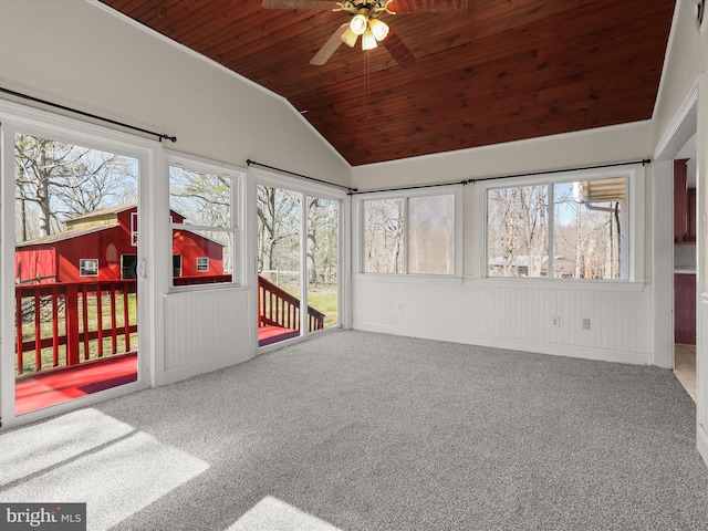 unfurnished sunroom with a ceiling fan, lofted ceiling, and wood ceiling