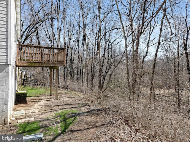 view of yard featuring a wooden deck