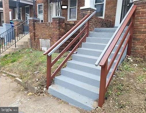 exterior details with stairs and brick siding