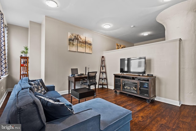 living room featuring wood finished floors and baseboards