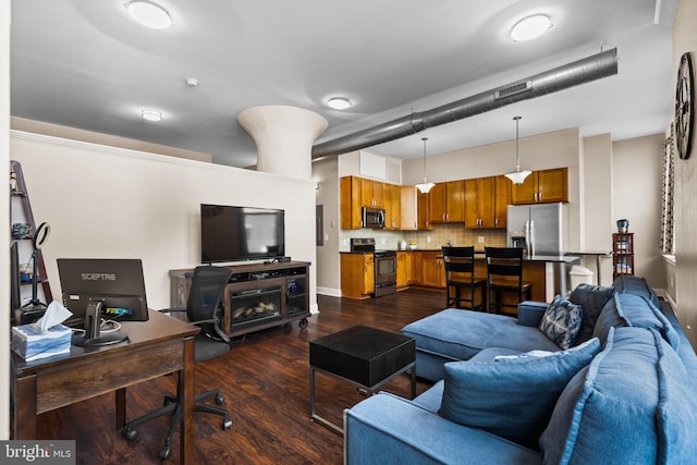 living room with visible vents and dark wood-style flooring