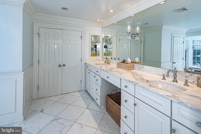 bathroom with a sink, double vanity, visible vents, and a closet