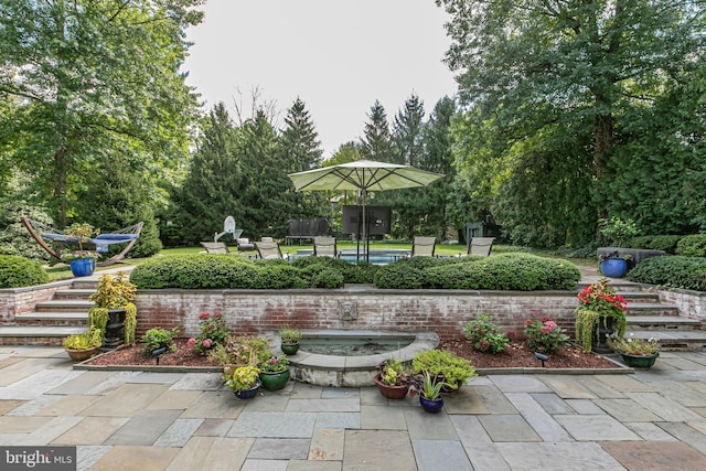 surrounding community featuring a patio area