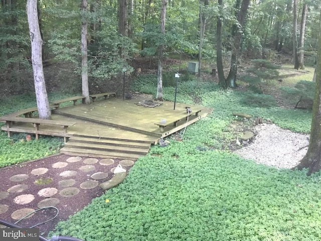 view of yard with a wooden deck