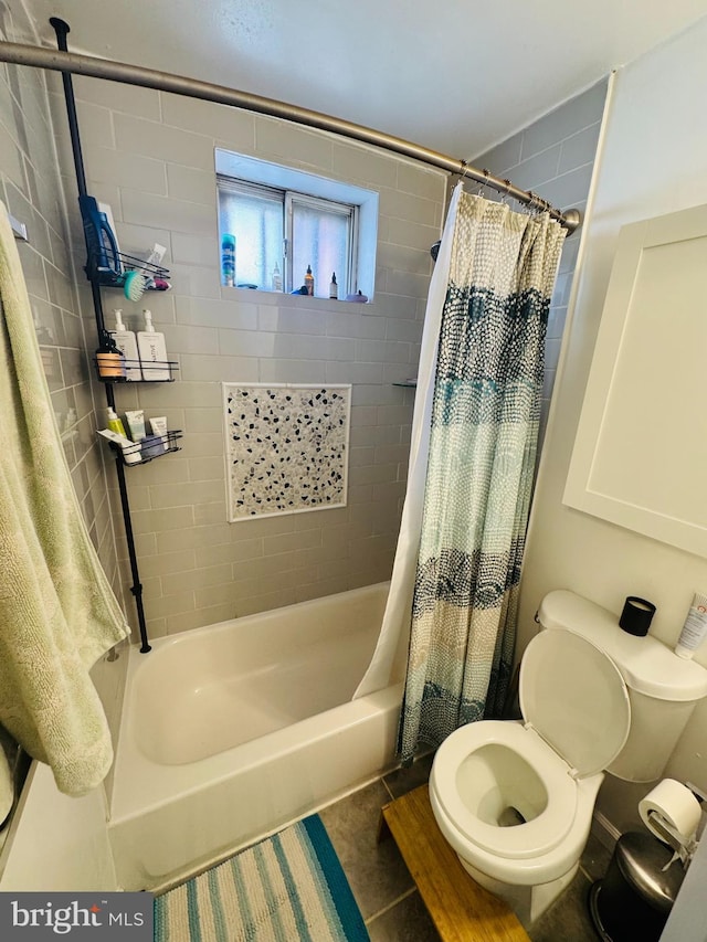 full bath with tile patterned flooring, toilet, and shower / bath combo with shower curtain