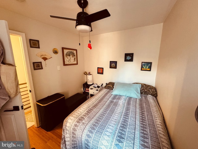 bedroom featuring ceiling fan and wood finished floors