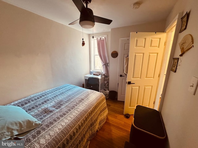 bedroom with ceiling fan and wood finished floors