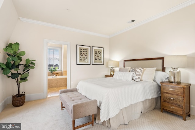 bedroom with ensuite bathroom, light colored carpet, visible vents, baseboards, and ornamental molding