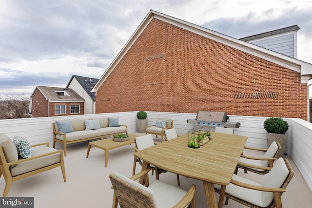 view of patio / terrace with outdoor dining space, a balcony, and an outdoor hangout area