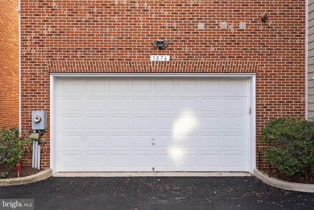 garage featuring driveway