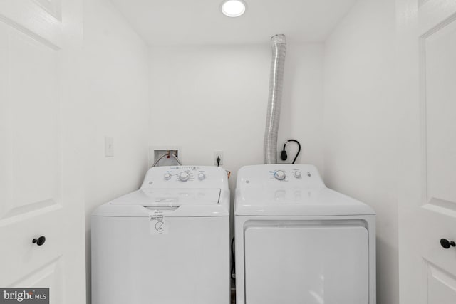 laundry room featuring separate washer and dryer