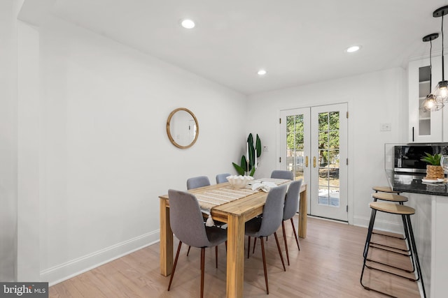 dining room with recessed lighting, french doors, light wood-style flooring, and baseboards