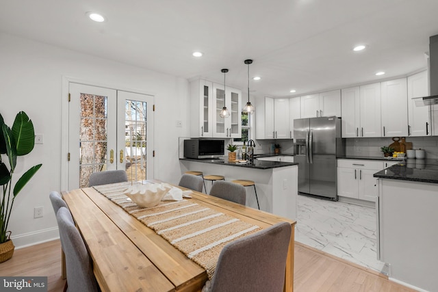 dining area with recessed lighting, french doors, marble finish floor, and baseboards