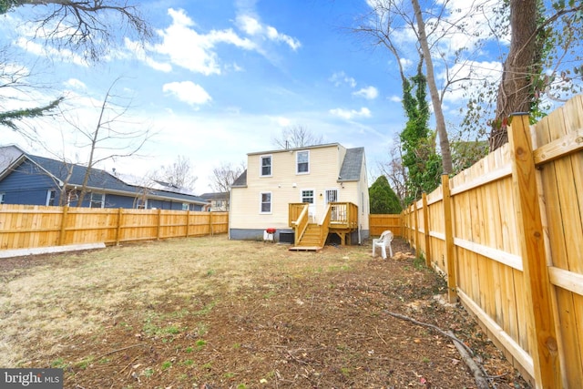 back of house with a deck, central AC unit, and a fenced backyard