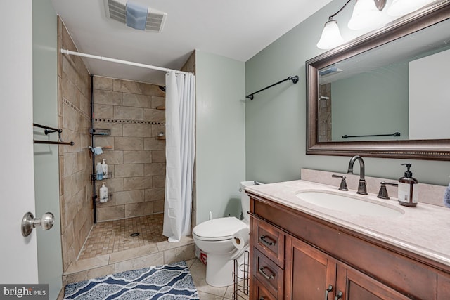 full bathroom with toilet, vanity, visible vents, a shower stall, and tile patterned floors