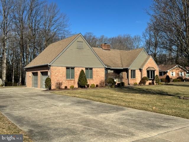 ranch-style home with brick siding, a chimney, concrete driveway, a garage, and a front lawn