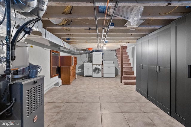 unfinished below grade area featuring stairway and light tile patterned floors