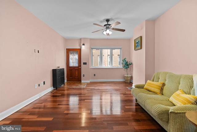 entrance foyer featuring ceiling fan, dark wood-type flooring, and baseboards