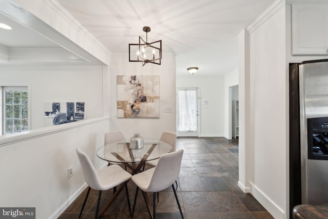 dining room featuring ornamental molding, a wealth of natural light, and stone tile flooring