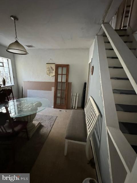 dining area featuring stairs and visible vents