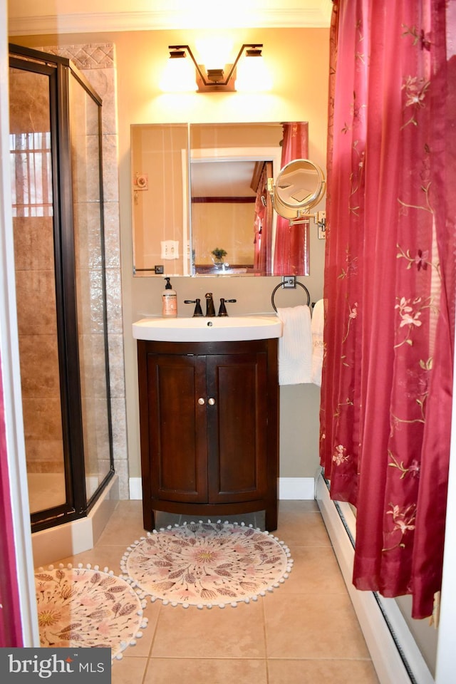 bathroom with baseboard heating, tile patterned flooring, vanity, and crown molding