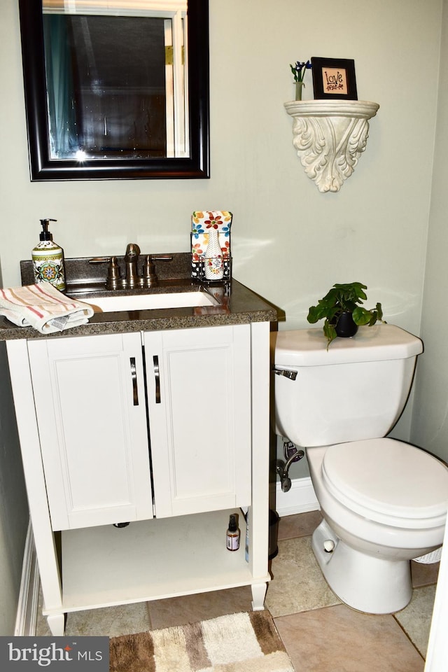 half bath with vanity and toilet