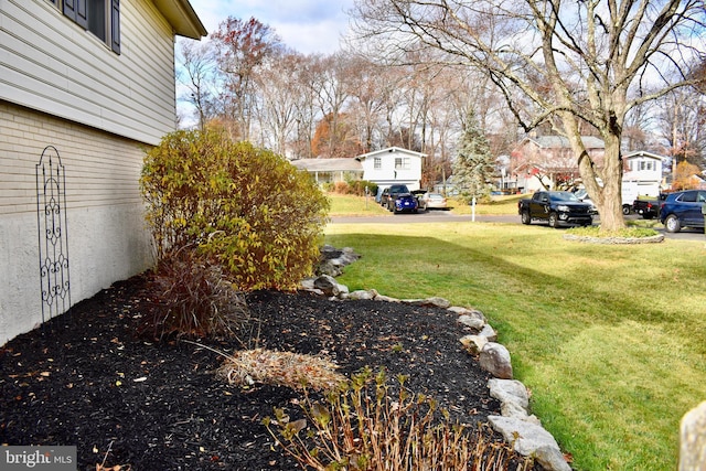 view of yard featuring a residential view