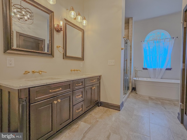 full bathroom with a freestanding bath, double vanity, a sink, and a shower stall