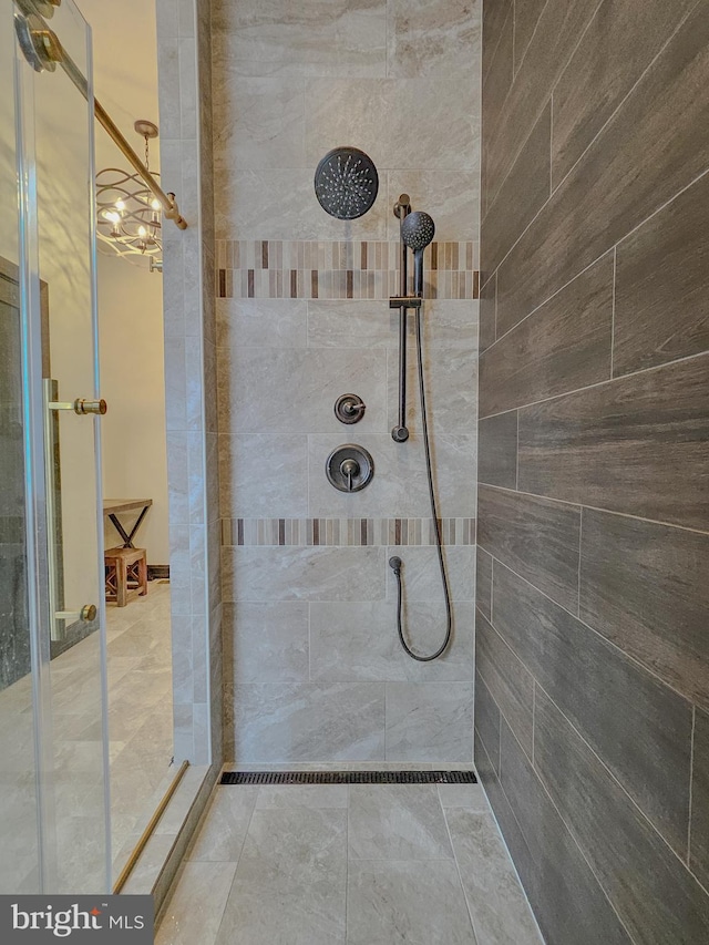 bathroom with tiled shower