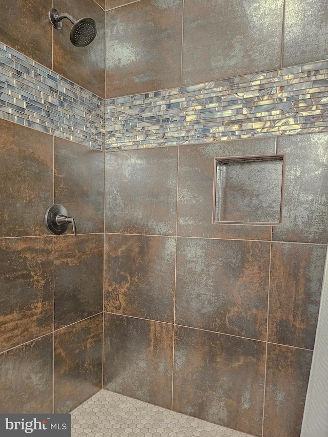 room details with a tile shower