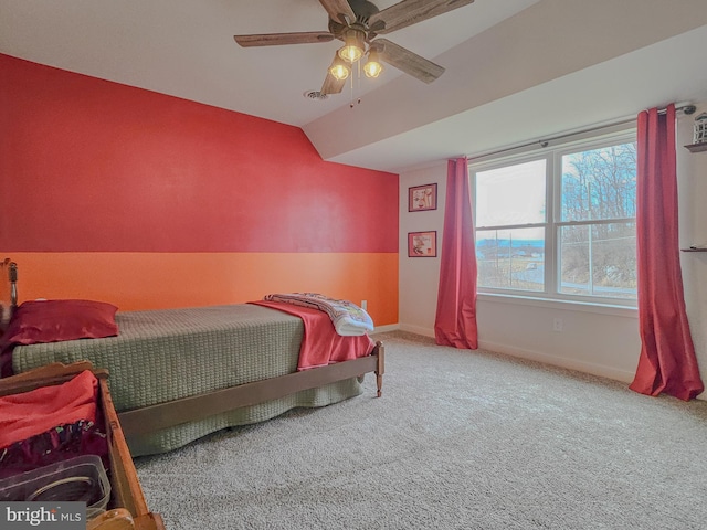 bedroom with lofted ceiling, carpet flooring, ceiling fan, and baseboards