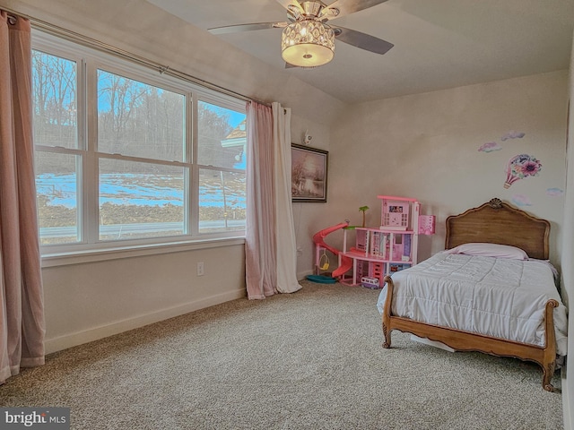 carpeted bedroom with baseboards and a ceiling fan