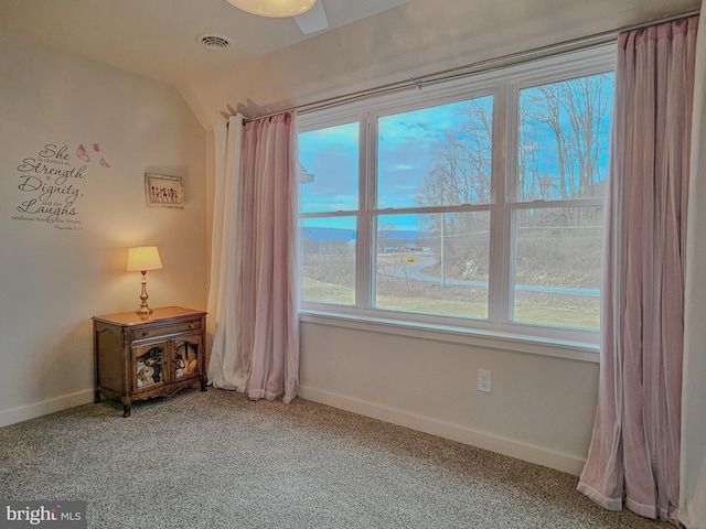 interior space with visible vents, baseboards, and carpet flooring