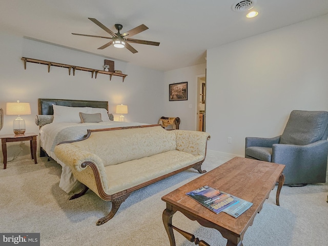 bedroom featuring light carpet, visible vents, and a ceiling fan