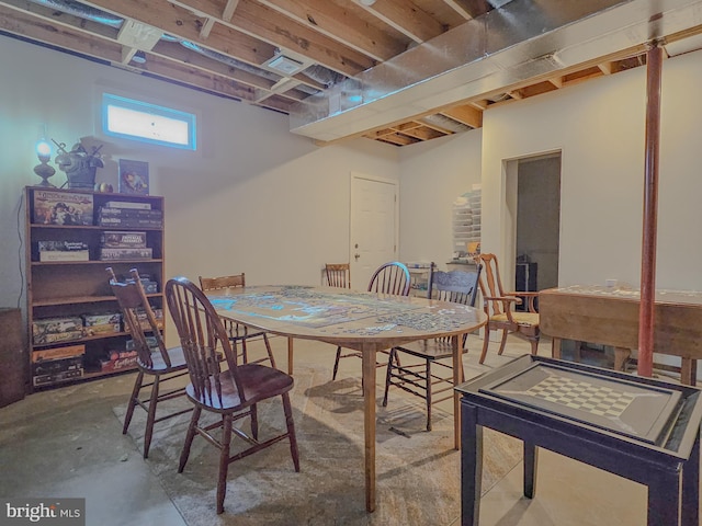 dining room with unfinished concrete flooring