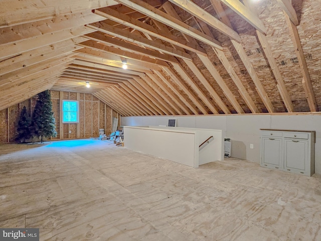 attic featuring an upstairs landing