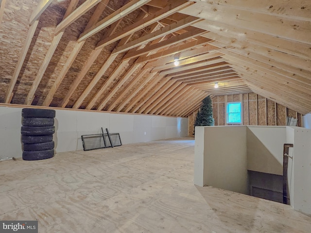 attic featuring an upstairs landing