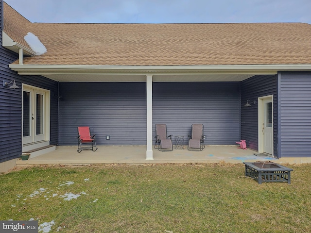 view of patio / terrace featuring an outdoor fire pit and french doors