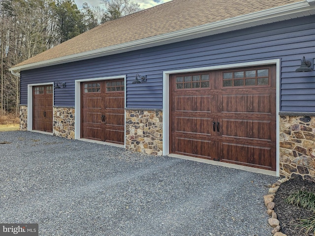 garage featuring driveway