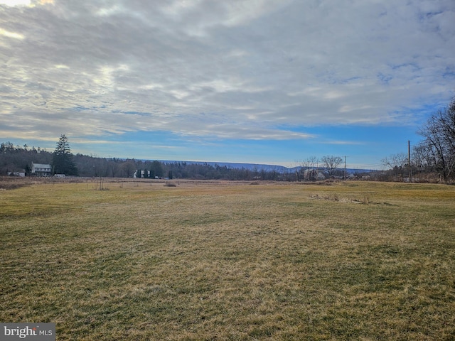 property view of mountains featuring a rural view