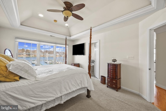 bedroom featuring recessed lighting, carpet flooring, baseboards, a tray ceiling, and crown molding