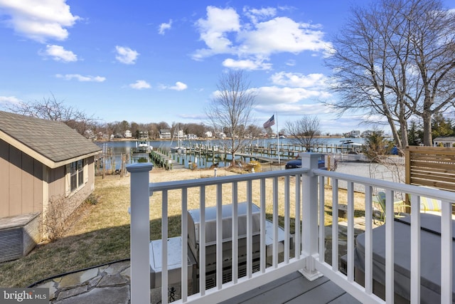 wooden deck featuring a water view